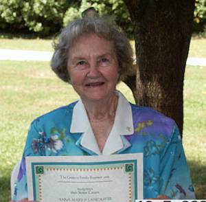 Anna Mary P. Lancaster shows her 80+ Certificate