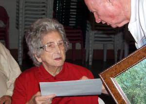 Ophelia Gregory Lyons, the oldest attendee receiving her certificate and a print of Juxa